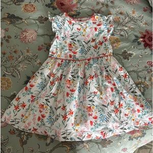 We bought this dress in Spain. It has a little peekaboo detail in the back.